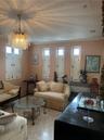 Living Room with marble floors leads to dining room on the right and family/bonus room to the left.