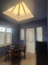 Breakfast Nook is a few steps up from the Kitchen and door to the side entryway.