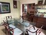 The formal Dining Room has French Doors that lead to the backyard gardens, pool and spa area.