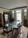 Formal Dining Room with doors to the back yard gardens.