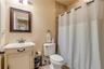 Full bathroom downstairs for guest bedrooms