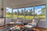 Pond house with wood finished floors, vaulted ceiling