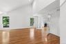 Formal living room with vaulted ceilings