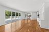 Family room leading into large eat in kitchen. Sliding doors to deck.