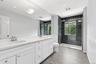 Second story full bath with dual sinks and walk in shower