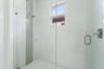 Glass-enclosed shower with window