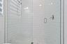 Subway tile shower with glass door