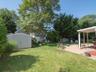 View of yard featuring a patio area and a shed