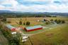 Backdrop for the farm, riding area and hay barn in the fore ground