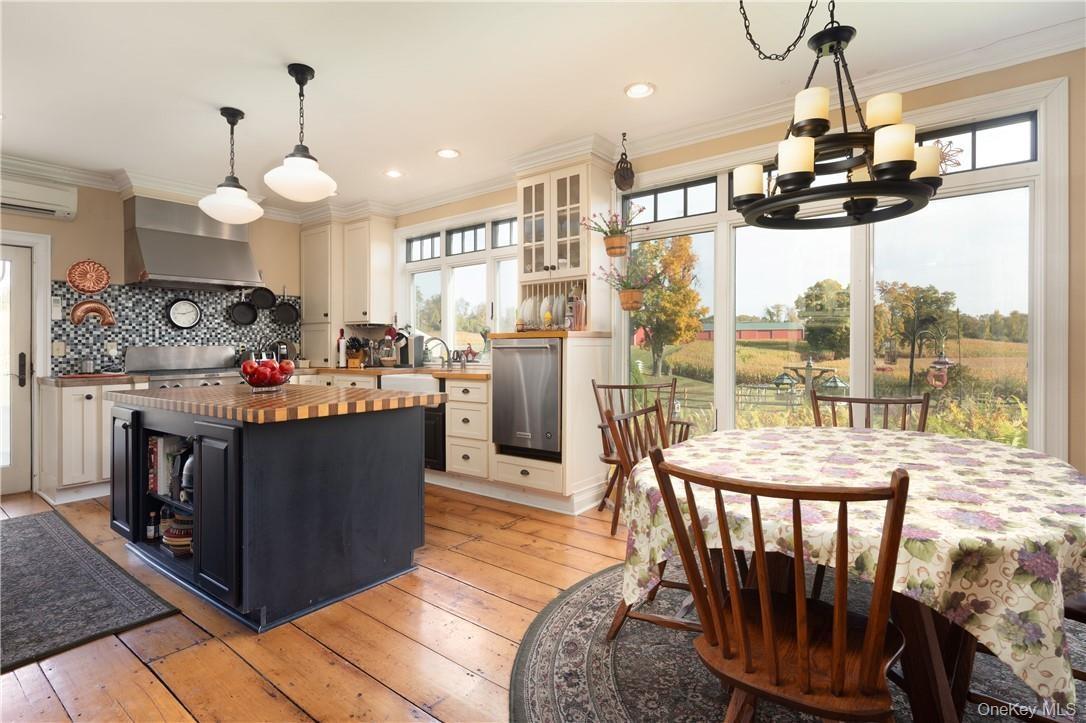 Kitchen with butcher block counters, a healthy amount of sunlight