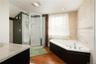 wood flooring, vanity,, and independent shower and jacuzzi