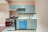 granite countertop, whirlpool stove, and dishwasher, tiled walls, gray on gold cabinets
