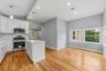 Totally new EIK with SS appliances, Quartz counter tops, island & door to porch