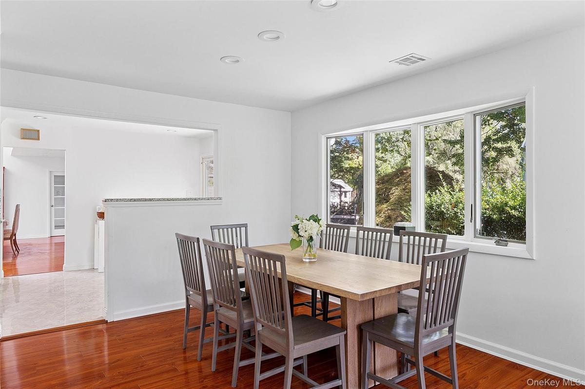 Breakfast table open to kitchen and living room