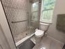 Primary Bathroom Shower with beautiful tile.