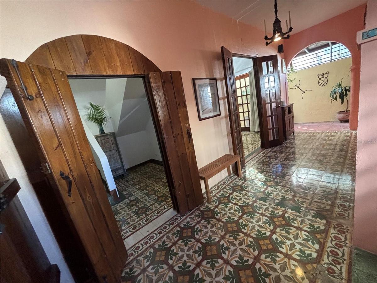 Entry foyer has newly restored antique floor tiles from 1915. These 'creole' tiles are considered museum-quality and highly prized in the few Santurce