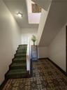 The stairway has a separate secure foyer. You can see the change from classic 1915 tiles on the first floor to the terrazzo style on the unique Art De