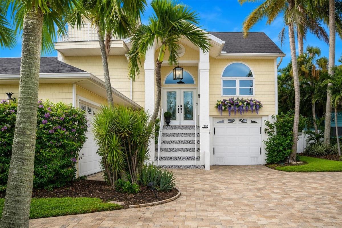 Grand entry with double leaded-glass doors. Plenty of parking — rare for the beach!