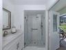 The second full bath doubles as a pool bath and is shared by both the second and third bedrooms
