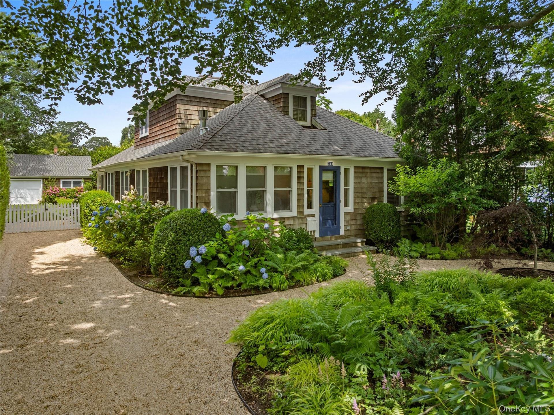 Shingle-style home with a shingled roof