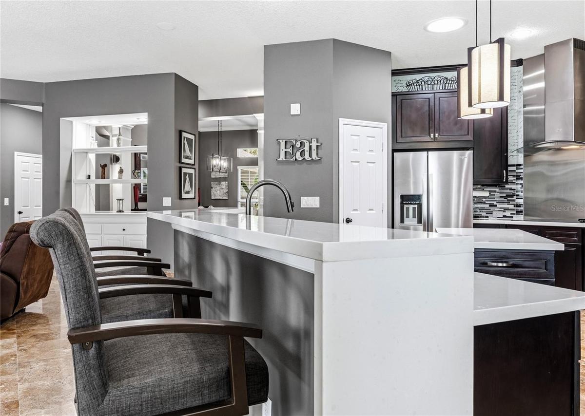 Quartz counters highlight the Breakfast Bar area!