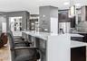 Quartz counters highlight the Breakfast Bar area!