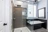 Tiled Shower with glass wall and entry door!
