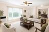 VIRTUALLY STAGED. Spacious living area featuring light-toned tile flooring and a ceiling fan