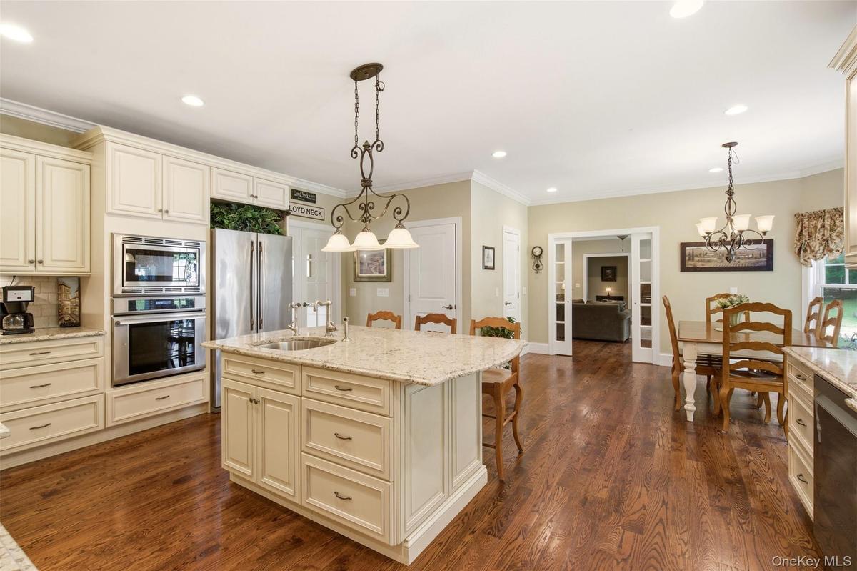 Eat in kitchen with glass doors open to family room