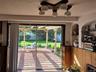 Glass sliders to the brick patio and pergola