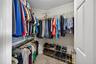 Walk-in closet is too large to fit in one photo!