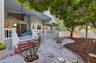 Covered back porch adds outdoor living enjoyment with a shady fenced-in, low-maintenance backyard, perfect for relaxing and entertaining. Roomy enough