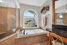 No need for a window covering; you can let the let stream in! Perfect secret garden area is plumbed, in case you have a green thumb