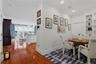 View from the den/office showcasing the homes open-concept layout and seamless flow to the kitchen and living room