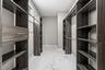 Custom walk in closet designed for exceptional storage