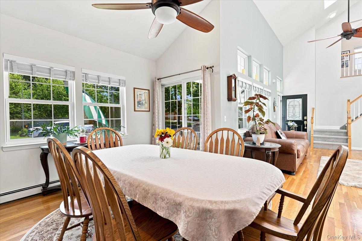 Formal dining room with sliders to front rocking chair porch