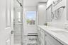 Brand new primary bathroom with instant hot water.