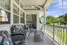 Cozy rocking chair porch with entry to great room or formal dining room