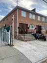 View of front of property with brick siding