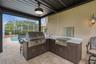 new outddor kitchen with grill and wok