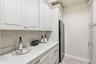 butlers pantry with wine refig and refrig