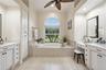 soaking tub in primary bathroom