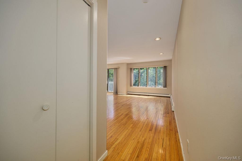 Entrance to the Primary Bedroom with one of two closets on the left as you enter