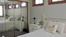 Mirrored closet doors with wood-finish framing