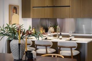 Bespoke kitchen with composite stone worktops and island in a Pavilion apartment, Sunningdale Park