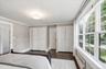 Primary bedroom with beautiful Pella Windows and 2 double closets
