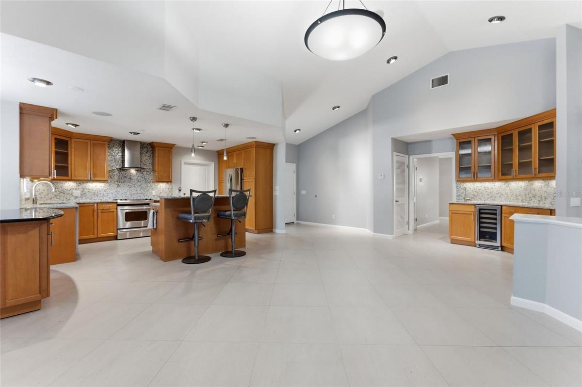 Kitchen with wet bar on right of picture