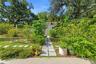 looking from concrete patio to small outbuilding