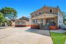 Multi-story residential property featuring a stucco and siding exterior