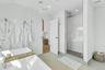 Contemporary bathroom featuring a freestanding soaking tub and a spacious glass-enclosed shower with a rainfall showerhead